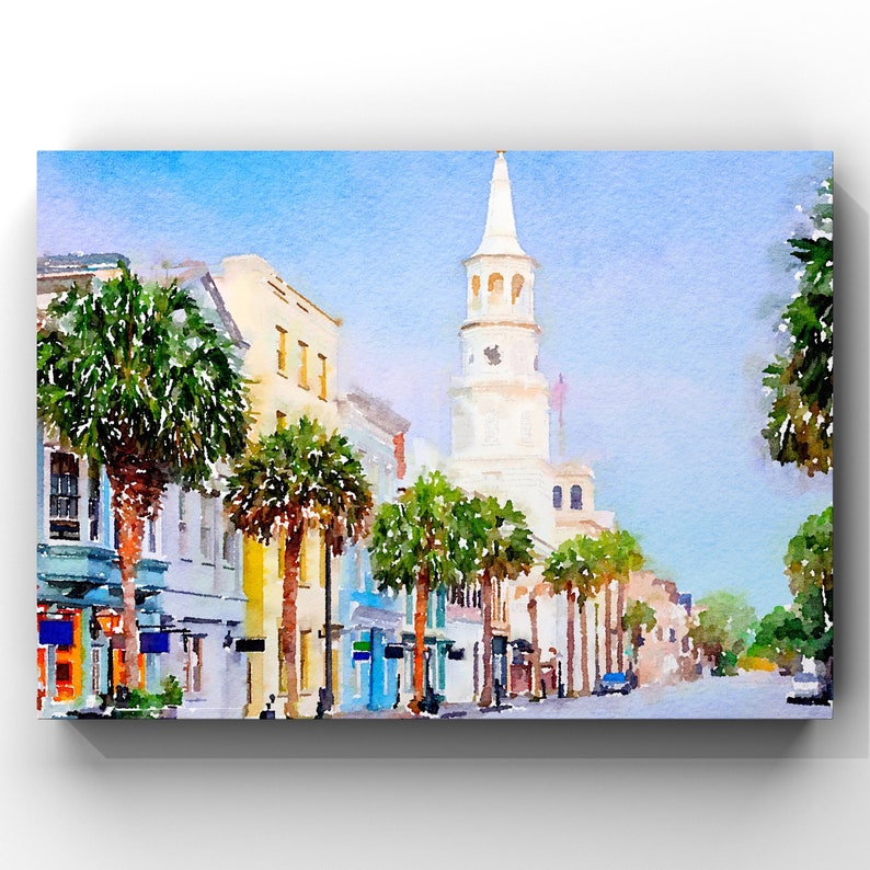 May include: Watercolor painting of a street scene with buildings and palm trees. A tall white church steeple dominates the background. The buildings are painted in shades of blue, yellow, and white, with a clear blue sky.
