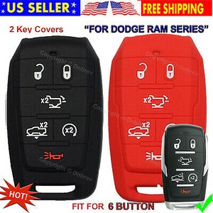 May include: Black and red key fob covers for a Dodge Ram series vehicle. The covers have six buttons with white icons and are made of a flexible material. The image includes the text "US Seller" and "Free Shipping".