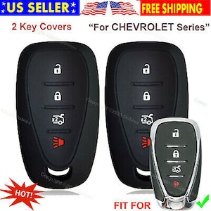 May include: Black key covers for a Chevrolet series vehicle. The image shows two key covers and a key. The key covers have white icons for lock, unlock, and other functions. The text "2 Key Covers" is visible.
