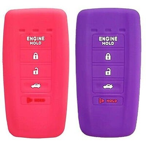 May include: Two silicone car key covers, one red and one purple. Each cover has the words "ENGINE HOLD" above four buttons: lock, unlock, car, and "HOLD". The covers are designed to protect car keys.