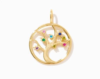 May include: A circular gold pendant featuring a tree silhouette with branches extending to the outer frame. The tree is adorned with small, round, multi-colored gemstones including pink, blue, green, and yellow stones set within the branches.