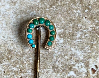 Victorian horseshoe stick pin with turquoise.