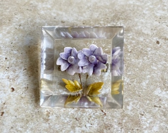 Lucite reverse carved flower brooch