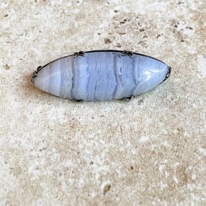 Vintage sterling silver blue lace agate brooch.