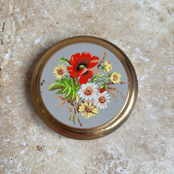 Vintage compact with wildflower poppy design