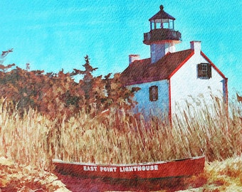 May include: A red boat with the words "East Point Lighthouse" painted on the side, sitting on a sandy beach in front of a white lighthouse with a red roof.