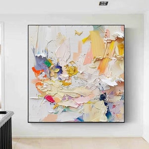 May include: Abstract painting with a white background and colorful brushstrokes in shades of pink, yellow, blue, green, and orange.