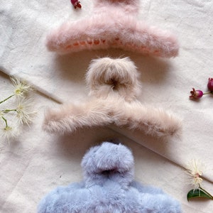 Large fluffy light weight hair claw match with the winter season