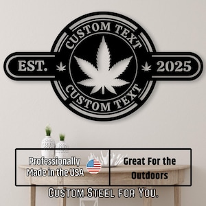 May include: Black metal wall art featuring a cannabis leaf design. The sign includes the text "CUSTOM TEXT" and "EST. 2025". The sign is designed for outdoor use and is professionally made in the USA.