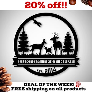 May include: Black metal silhouette of a deer family with two trees and a bird in a circle with the text "CUSTOM TEXT HERE" and "EST. 2014" below.