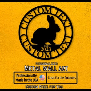 May include: Black metal wall art featuring a silhouette of a rabbit inside a circle with the text "CUSTOM TEXT" and "EST. 2023".