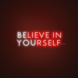 May include: White neon sign with the text "BELIEVE IN YOURSELF" on a red background.