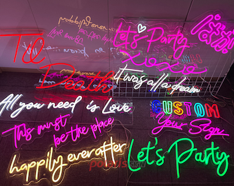 May include: A collection of neon signs with various phrases and designs, including "Til Death", "All you need is Love", "This must be the place", "Happily ever after", "Let's Party", "It was all a dream", and "Custom Your Sign".