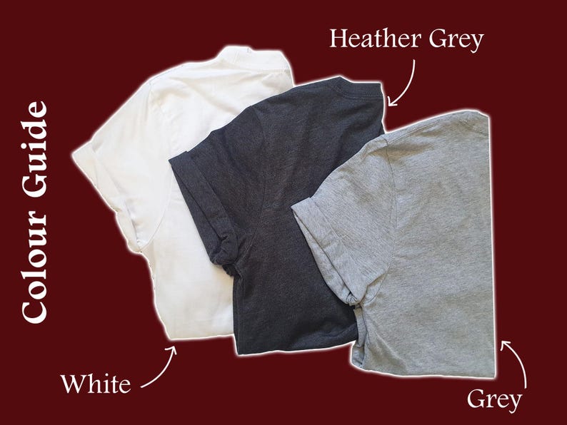 May include: Three t-shirts in different colours: white, heather grey, and grey. The t-shirts are laid out flat on a red background.