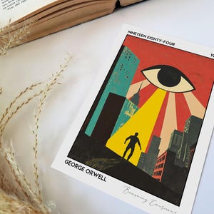 May include: A print featuring a stylized illustration from George Orwell's "Nineteen Eighty-Four." The artwork depicts a cityscape with a large eye, a figure in silhouette, and the text "Nineteen Eighty-Four" and "George Orwell."