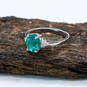 Zambian Emerald Ring: Sterling Silver, Cubic Zirconia Halo