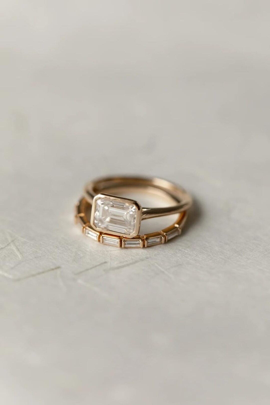 14K Gold Bezel Set Emerald Cut Moissanite Engagement Ring With Baguette ...