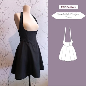 May include: A black corset-style pinafore dress with a flared skirt and wide shoulder straps on a mannequin. The image includes a white graphic illustration of the dress and text that reads PDF Pattern and Corset-Style Pinafore Dress.