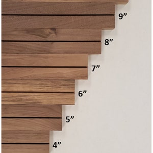 May include: A set of eight wooden slats, each with a different length, ranging from 3 inches to 10 inches. The slats are arranged in a staggered pattern, with the longest slat at the top and the shortest slat at the bottom.