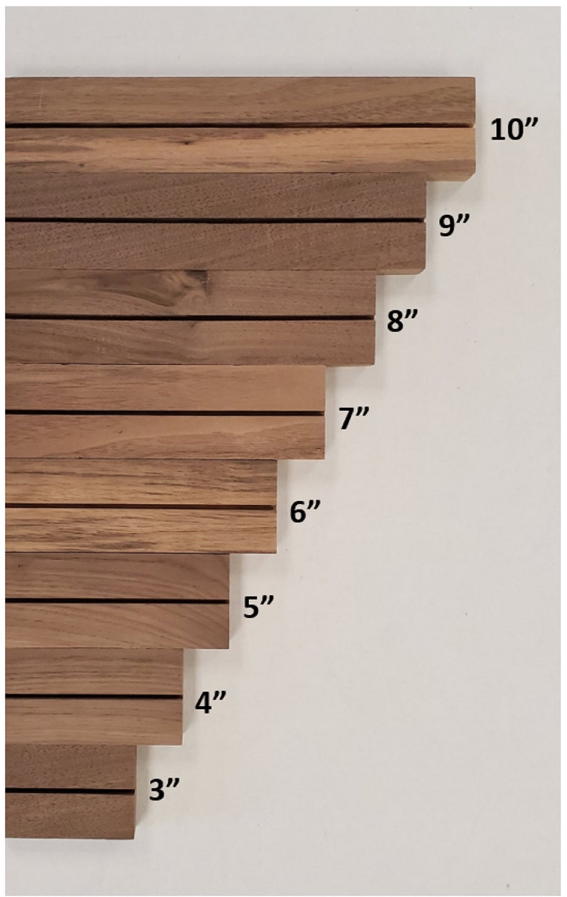 May include: A set of eight wooden slats, each with a different length, ranging from 3 inches to 10 inches. The slats are arranged in a staggered pattern, with the longest slat at the top and the shortest slat at the bottom.