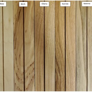 May include: A wood sample chart showing the grain and color of 10 different types of wood: Poplar, Maple, Bass, Birch, Cherry, Red Oak, Butternut, Walnut, Eastern Red Cedar.