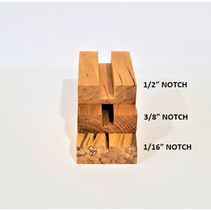 May include: Four wooden blocks stacked on top of each other, each with a different sized notch cut out. The notches are labeled 1/16", 3/8", and 1/2".