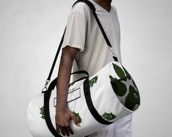 Bolsa de lona Wildcat Nation con etiqueta de propiedad y estampado de gato montés verde.