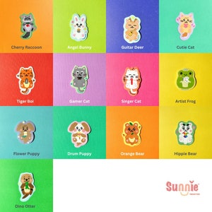 May include: A set of 12 colorful stickers featuring cute animal characters with different personalities. Each sticker has a unique design and features a different animal, such as a raccoon, bunny, deer, cat, frog, puppy, bear, and otter. The stickers are perfect for adding a touch of whimsy to your planner, laptop, water bottle, or any other surface.