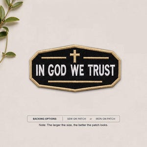 May include: A black embroidered patch with a gold border, featuring a gold cross symbol above the white text "IN GOD WE TRUST" and horizontal gold lines. Below the patch, text reads: "BACKING OPTIONS: SEW ON PATCH or IRON ON PATCH".