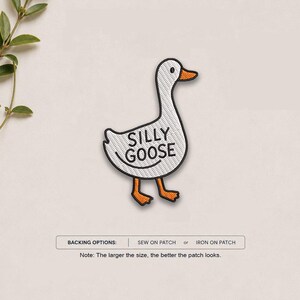 May include: An embroidered patch shaped like a white goose with an orange beak and feet. The goose has black outlines and the text SILLY GOOSE embroidered in black on its body. Below the patch, text reads BACKING OPTIONS: SEW ON PATCH or IRON ON PATCH.