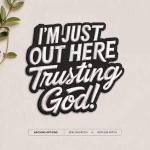May include: A black embroidered patch featuring the white text I'M JUST OUT HERE TRUSTING GOD! in a bold, layered font style. Below the patch, a rectangular label displays the text BACKING OPTIONS: SEW ON PATCH or IRON ON PATCH.