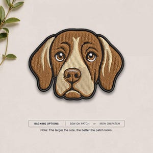 May include: An embroidered patch featuring the head of a brown and tan dog with large eyes and floppy ears. The patch has a black border. Below the patch, text reads: BACKING OPTIONS: SEW ON PATCH or IRON ON PATCH. Note: The larger the size, the better the patch looks.