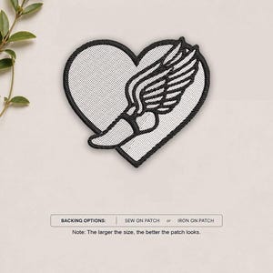 May include: An embroidered patch featuring a white heart shape with a black border and a black winged foot design in the center. Below the patch, text reads: BACKING OPTIONS: SEW ON PATCH or IRON ON PATCH. Note: The larger the size, the better the patch looks.