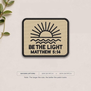 May include: A rectangular embroidered patch with a tan background and black border. It features a black embroidered sun rising over wavy lines, with the text BE THE LIGHT and MATTHEW 5:14 below. Text at the bottom reads BACKING OPTIONS: SEW ON PATCH or IRON ON PATCH.