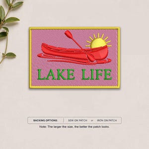 May include: A rectangular embroidered patch with a pink background and a yellow border. It features a red canoe with a red paddle and a yellow sun. The text "LAKE LIFE" is embroidered in green below the canoe. Text below reads: BACKING OPTIONS: SEW ON PATCH or IRON ON PATCH. Note: The larger the size, the better the patch looks.