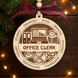 May include: Wooden Christmas ornament with the words "Office Clerk" and related icons, including a laptop, folders, and a pie chart. The ornament has a red and black plaid ribbon for hanging.