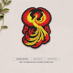 May include: An embroidered patch featuring a phoenix with vibrant yellow and red thread on a black background. The design shows the bird with wings spread and a long, flowing tail. Text below reads: BACKING OPTIONS: SEW ON PATCH or IRON ON PATCH.