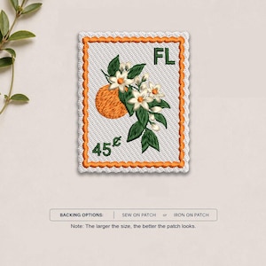 May include: A rectangular embroidered patch shaped like a postage stamp with an orange border. The design features an orange fruit, green leaves, and white blossoms. The text FL is in the top right and 45 cents is in the bottom left corner.