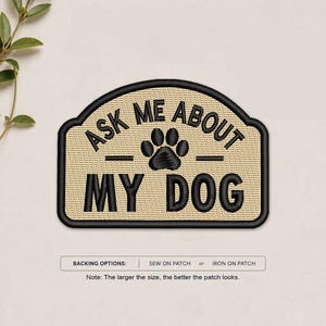 May include: A rectangular embroidered patch with rounded top corners featuring a tan background and black border. The text reads ASK ME ABOUT MY DOG with a black paw print in the center. Below is a label for backing options and a note.