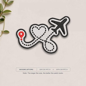 May include: An embroidered patch featuring a black airplane silhouette and a red location pin connected by a dashed black flight path that forms a heart shape. The text below reads: BACKING OPTIONS: SEW ON PATCH or IRON ON PATCH. Note: The larger the size, the better the patch looks.