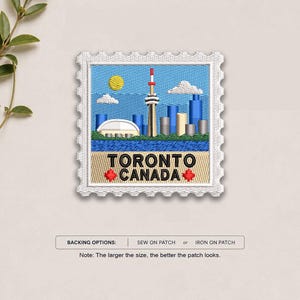 May include: A square embroidered patch shaped like a postage stamp featuring the Toronto skyline with the CN Tower, a yellow sun, and white clouds against a blue sky. The text TORONTO CANADA is stitched in black with two red maple leaf icons.