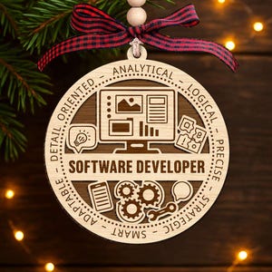 May include: Wooden Christmas ornament with a computer graphic and the words "SOFTWARE DEVELOPER." The ornament has a red and black plaid ribbon for hanging. The ornament also has the words "ANALYTICAL," "LOGICAL," "PRECISE," "STRATEGIC," "SMART," "ADAPTABLE," "DETAIL ORIENTED."