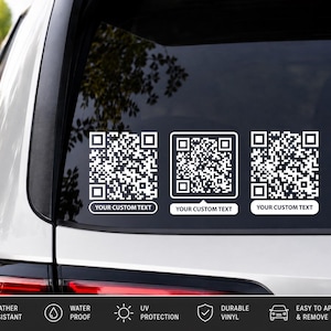 May include: Three white vinyl QR code decals applied to a vehicle rear window. Each square QR code features a rectangular white label underneath with the placeholder text YOUR CUSTOM TEXT printed in a bold, sans-serif black font.