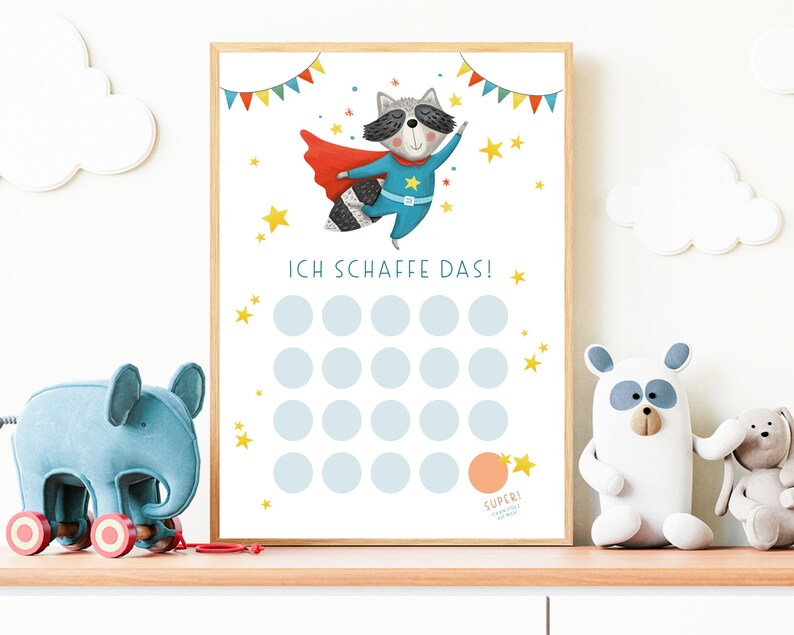 May include: A printable chart featuring a cartoon raccoon superhero with a blue cape and yellow star. The chart has 20 circles for marking progress and the text "ICH SCHAFFE DAS!" at the top.