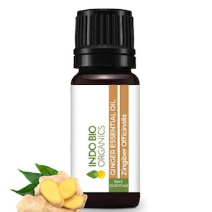 May include: A 15 ml (0.50 fl oz) bottle of Indo Bio Organics Ginger Essential Oil. The bottle is brown glass with a black cap. The label is white with green and brown text. The text on the label reads "Indo Bio Organics Ginger Essential Oil Zingiber Officinalis".