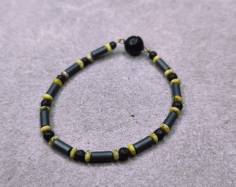 Handmade bracelet with hematite, lava stone and yellow stone