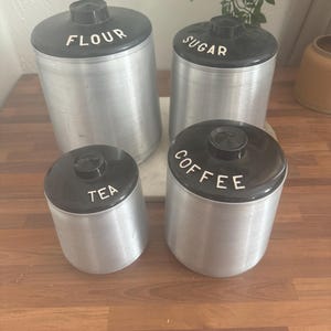 Vintage 4 Piece Canister Kitchen Set Aluminum Kromex Nesting Black and Silver Retro Storage Gift Coffee Tea Sugar Flour Rare with Lids