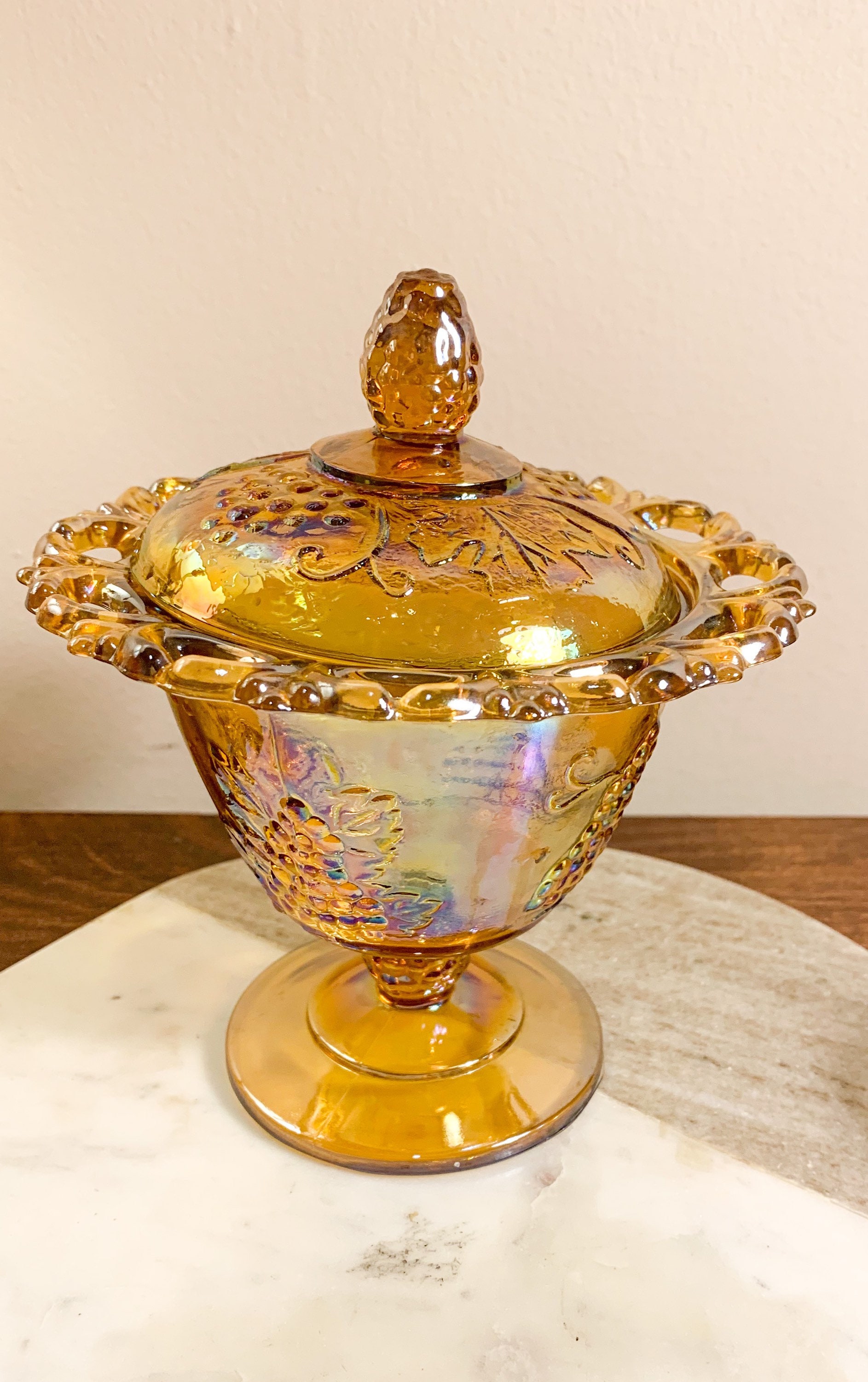 Carnival glass candy dish for $2. The history of these is so  Vintage Carnival Candy Dish with lid display picture 1