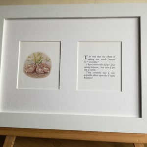May include: A framed illustration of three bunnies sleeping under a plant with the text "Tis said that the effect of eating too much lettuce is "soporific." I have never felt sleepy after eating lettuces; but then I am not a rabbit. They certainly had a very soporific effect upon the Flopsy Bunnies!"