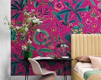May include: A bedroom interior with a pink floral wallpaper featuring a bed with a yellow headboard and a desk with a black lamp and a chair.